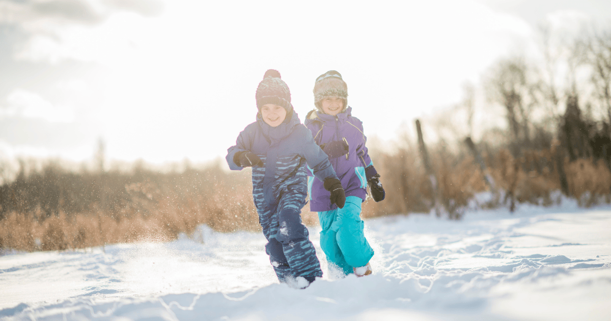 Children running in snow