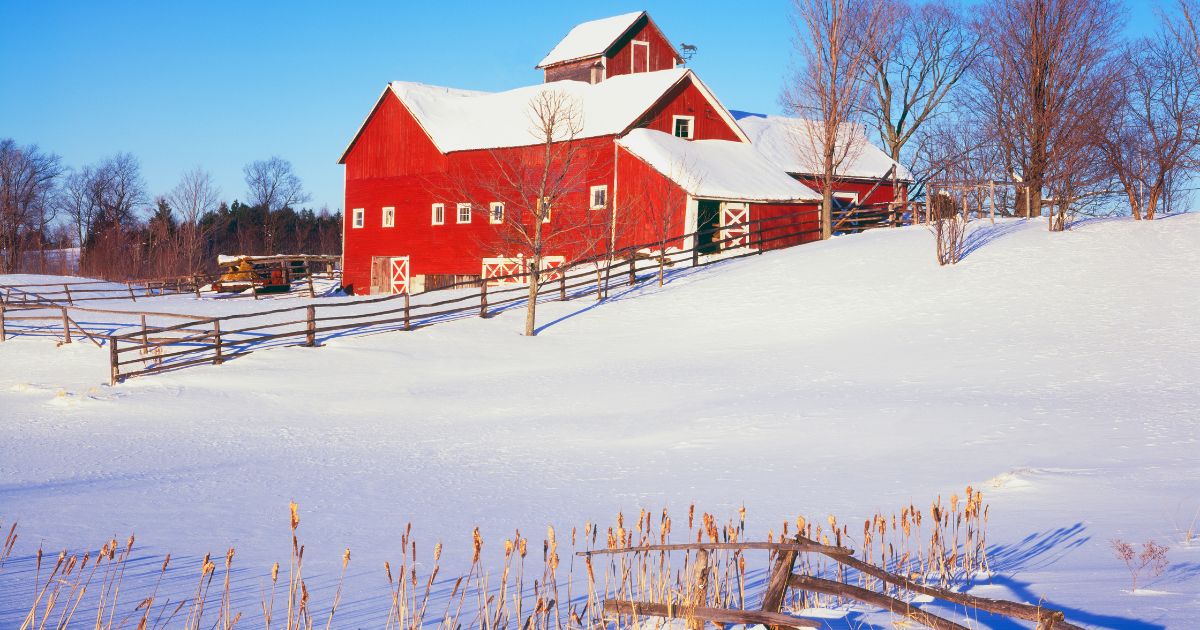 Red Vermont barn in New England winter snow